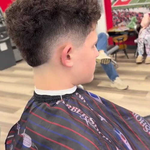 Curly fade at Alfred's Barbershop
