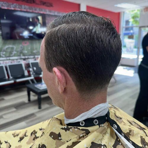 Scissor trim and neck taper at Alfred's Barbershop
